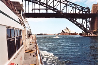 Sir David Martin passes under the harbour bridge as it heads towards Circular Quay